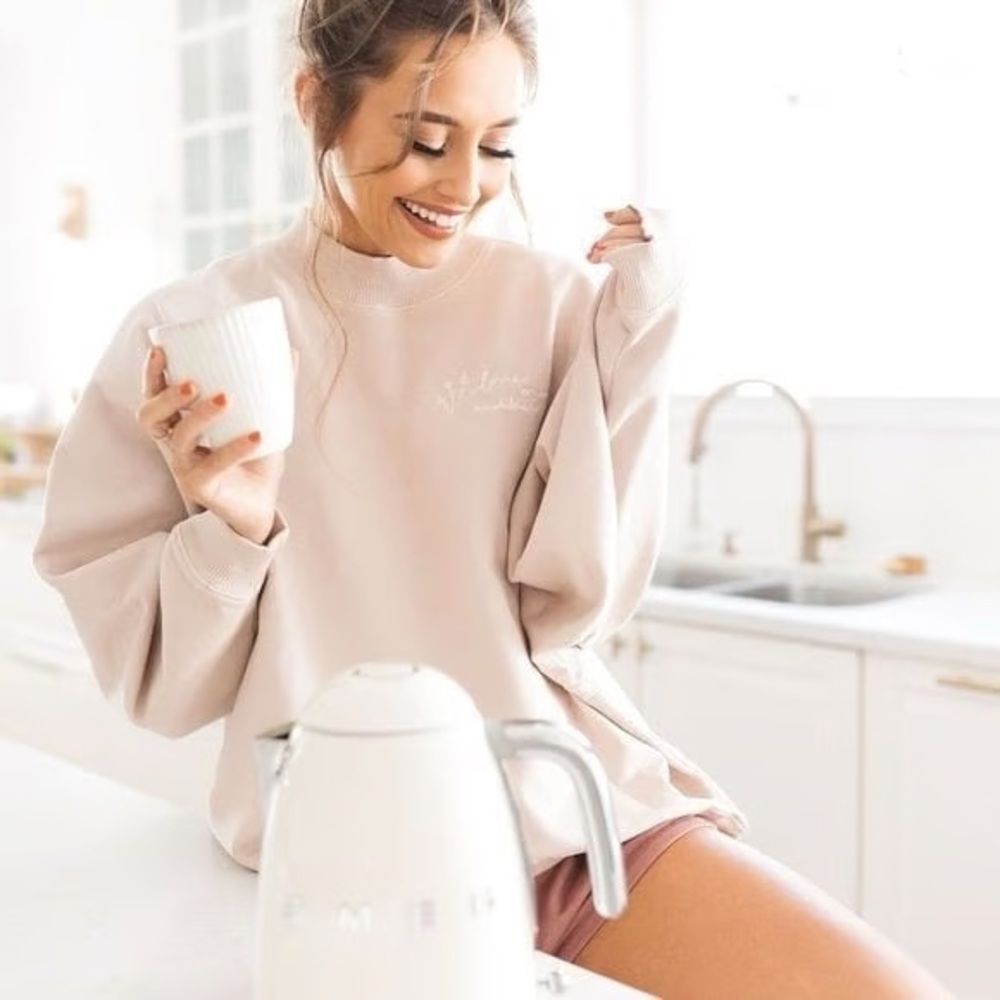 Kristin John’s Love One Another Oversized Sweatshirt